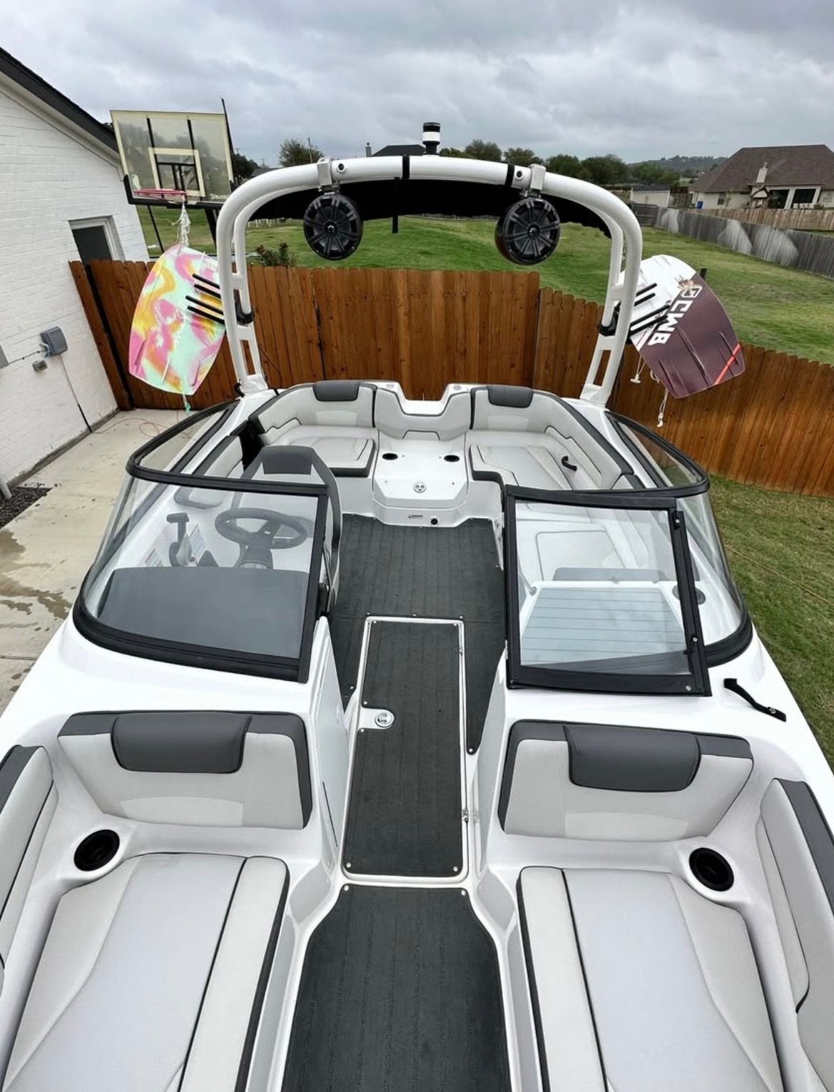Yamaha Boats AR190 2020 Yamaha AR190 boat interior with seating, speakers, and wakeboards.