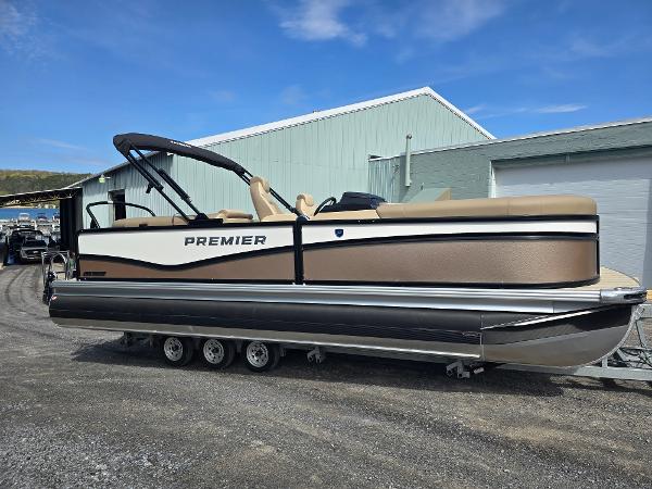Premier 230 SunSation RF 2025 Premier 230 SunSation RF pontoon boat parked outdoors, showcasing sleek design and modern features.