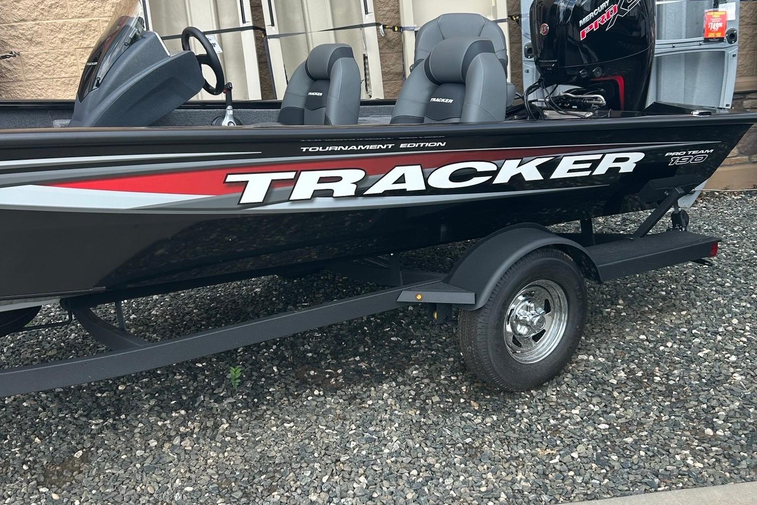 Tracker Pro Team 190 2026 Tracker Pro Team 190 boat on trailer, black with red and white accents.