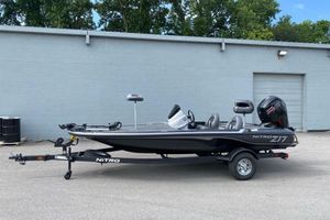Nitro Z17 2026 Nitro Z17 fishing boat on trailer, parked outdoors.