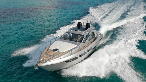 Pershing 5x 2021 Pershing 5X REMEDY yacht cruising on clear blue water.