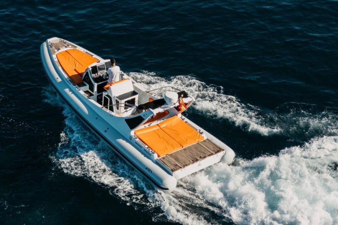RIB Indomita 30 2007 Indomita Rib 30 boat cruising on open water with orange seating.