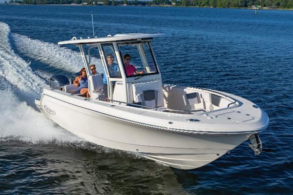 Robalo R272 Center Console Manufacturer Provided Image: 2023 Robalo R272 Center Console boat cruising on a lake with passengers.