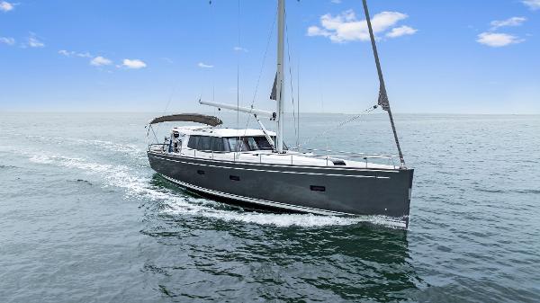 Moody 45 DS Sailing yacht Moody 45 DS 2021 cruising on open sea under clear blue sky.