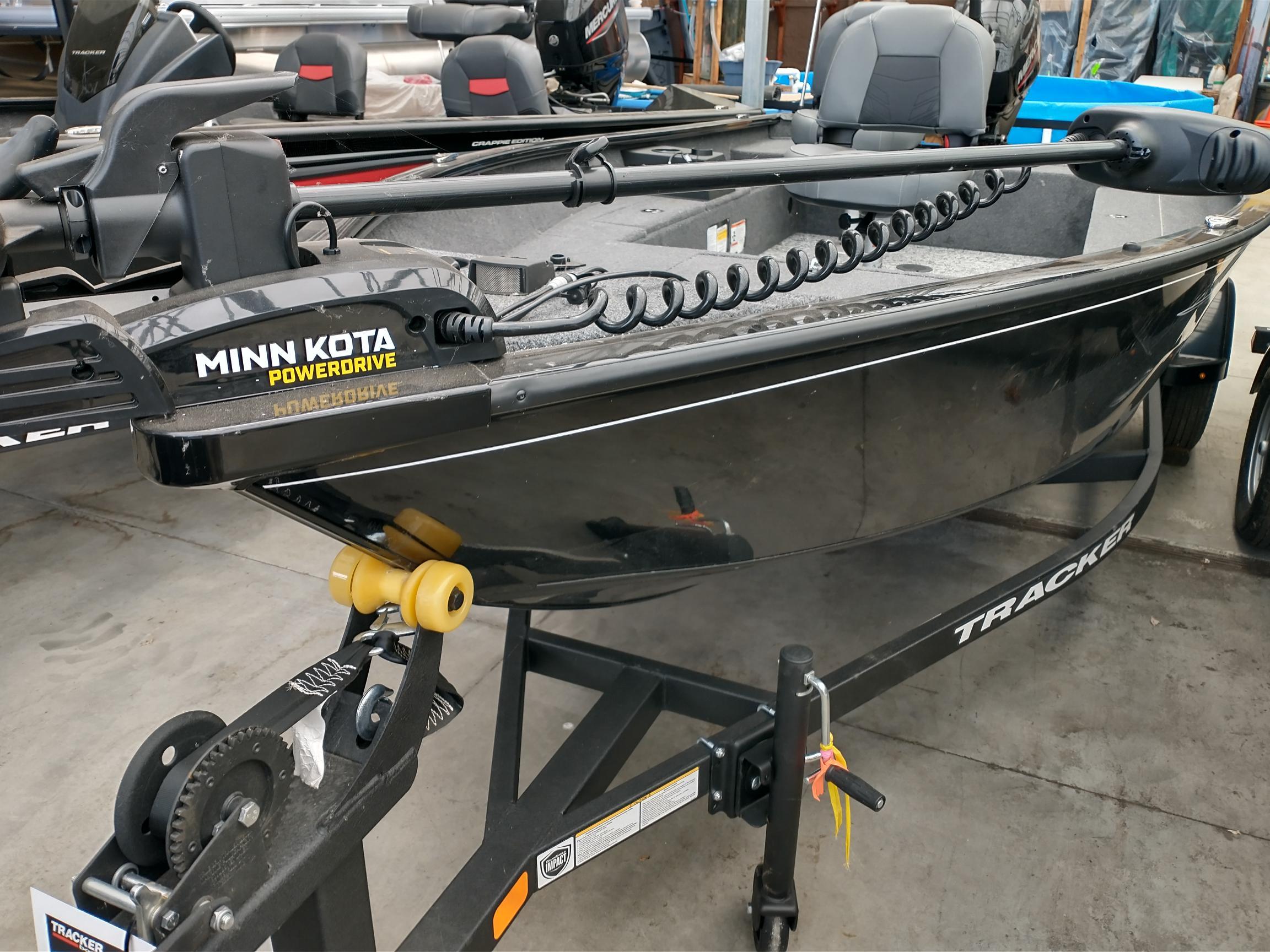 Tracker Super Guide V-16 T 2025 Tracker Super Guide V-16 T boat with Minn Kota PowerDrive motor on trailer.