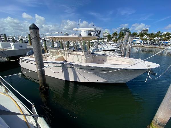 Grady-White Canyon 306 2016 Grady-White Canyon 306 boat docked in marina under clear blue sky.