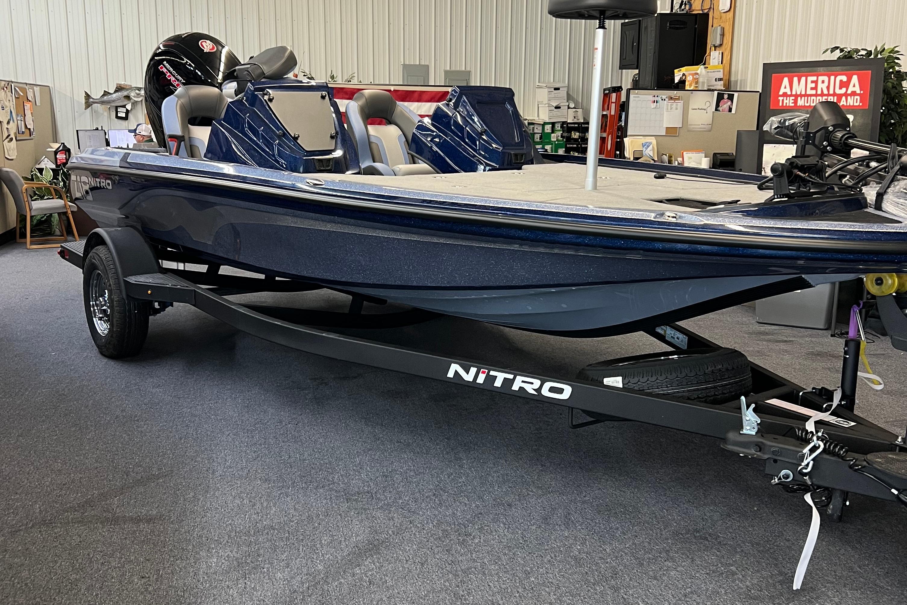 Nitro Z18 Pro 2026 Nitro Z18 Pro boat on trailer in showroom setting.