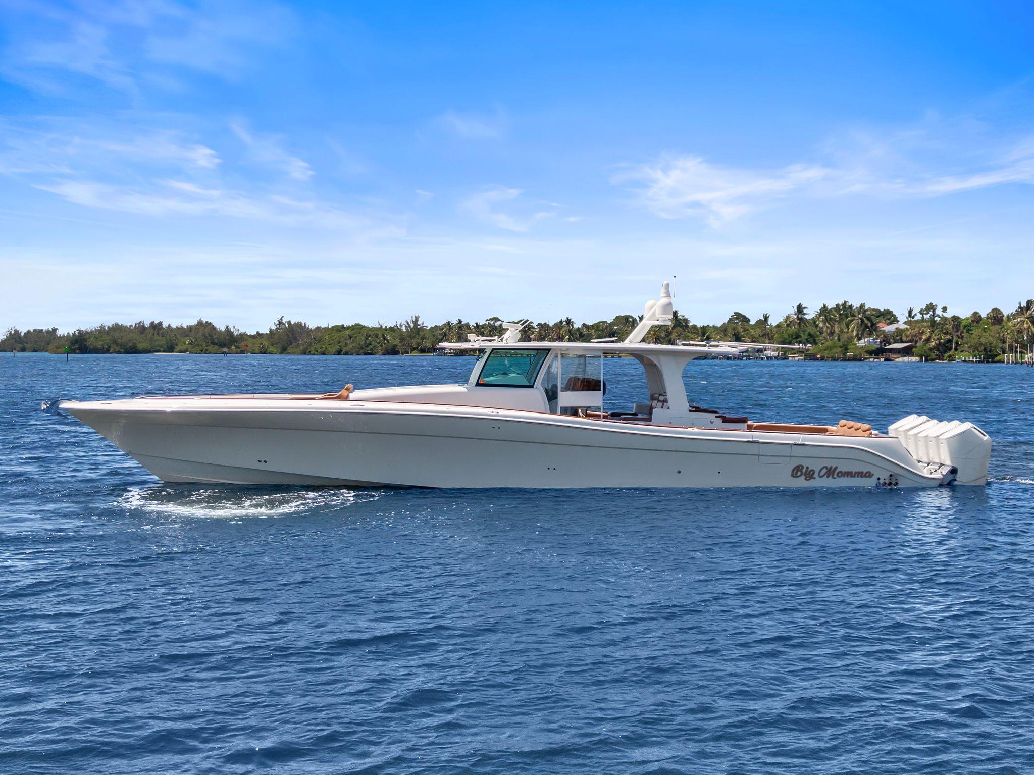 HCB 65 Estrella 2023 HCB 65 Estrella luxury boat cruising on blue water under clear sky.