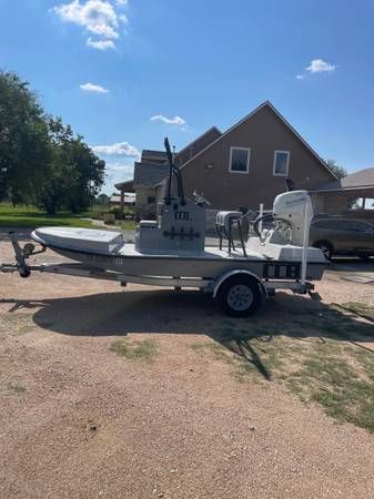 Custom CCB PHOENIX 2020 Custom CCB PHOENIX boat on trailer, parked in a sunny residential area.