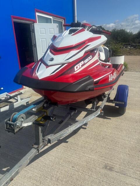 Yamaha WaveRunner GP1800R SVHO 2017 Yamaha WaveRunner GP1800R SVHO on trailer, red and white, parked outdoors.