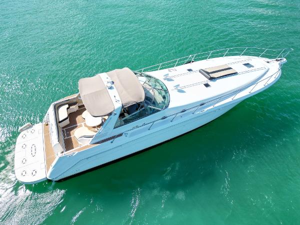 Sea Ray 500 Sundancer 1998 Sea Ray 500 Sundancer yacht cruising on clear turquoise water.