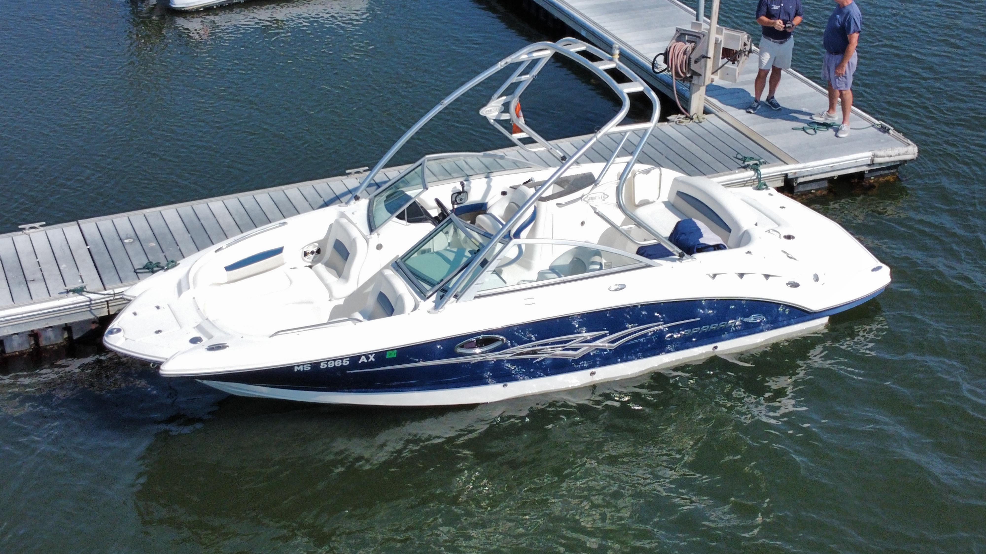 Chaparral Sunesta 244 2010 Chaparral Sunesta 244 boat docked at marina with two people nearby.