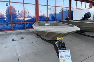 Tracker Grizzly 1648 Utility 2026 Tracker Grizzly 1648 Utility boat displayed outdoors on a trailer.