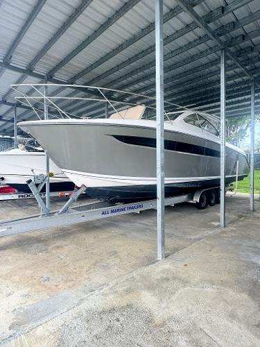 Pursuit SC 365i Sport Coupe 2016 Pursuit SC 365i Sport Coupe on trailer in covered storage.