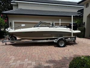 Stingray 191 DC 2020 Stingray 191 DC boat on trailer in front of garage.
