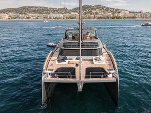 Sunreef 80 Eco Luxury Sunreef 80 Eco catamaran sailing in clear blue waters, 2023 model.