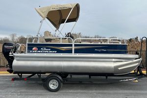 Sun Tracker Bass Buggy 16 XL Select 2025 Sun Tracker Bass Buggy 16 XL Select pontoon boat with canopy on trailer.
