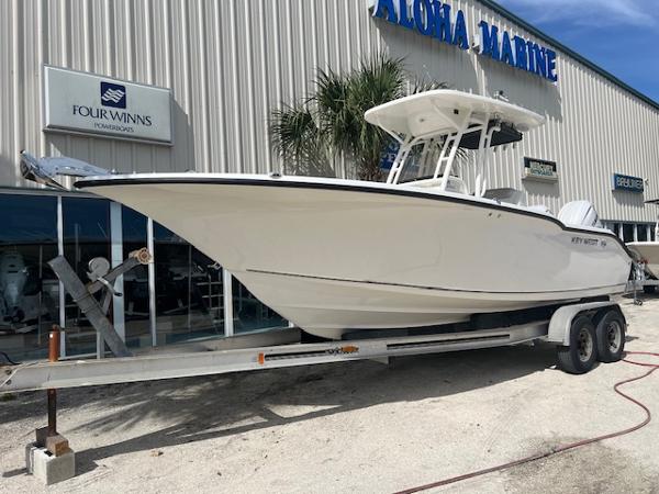Key West 244 Center Console 2024 Key West 244 Center Console boat on trailer at Aloha Marine dealership.