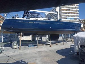 Beneteau Oceanis 50 2007 Beneteau Oceanis 50 sailboat on dry dock, blue hull, urban background.