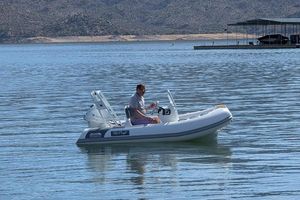 Tide Craft San Juan 11 Man on 2025 Tide Craft San Juan 11 boat in calm lake waters.