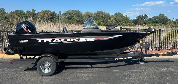 Tracker Pro Guide V-175 Combo 2025 Tracker Pro Guide V-175 Combo boat on trailer, parked outdoors.