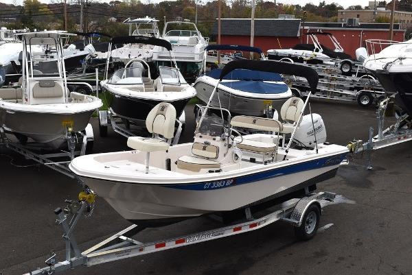 Carolina Skiff 178 JLS 2023 Carolina Skiff 178 JLS boat on a trailer in a marina.