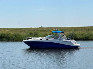 Sea Ray 340 Sundancer 2006 Sea Ray 340 Sundancer cruising on a calm lake under a clear blue sky.