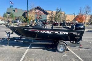 Tracker Pro Guide V-175 Combo 2026 Tracker Pro Guide V-175 Combo boat on trailer in parking lot.