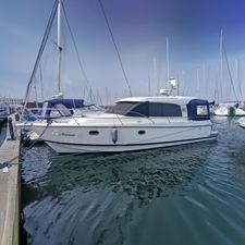 Nimbus 365 Coupe 2x 225HP Nimbus 365 Coupe 2014 boat docked in marina, side view.