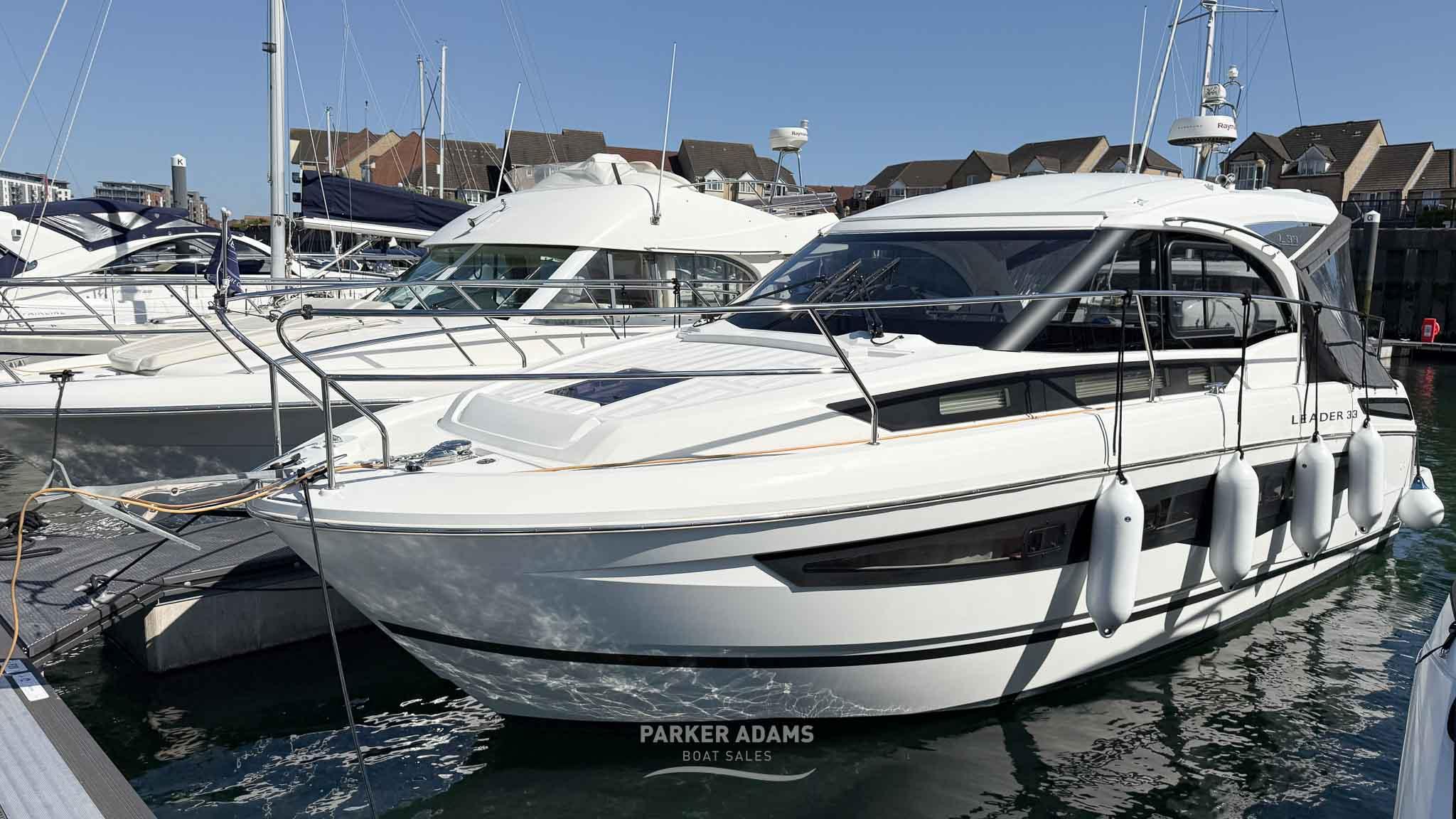 Jeanneau Leader 33 2022 Jeanneau Leader 33 yacht docked at marina, showcasing sleek design and modern features.