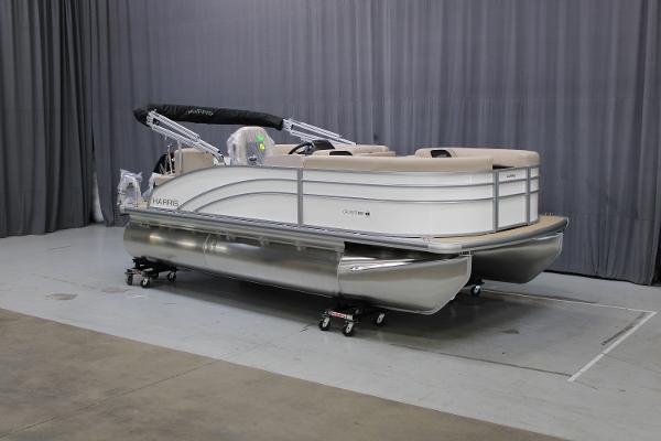 Harris Cruiser 190 2025 Harris Cruiser 190 pontoon boat in showroom, side view.