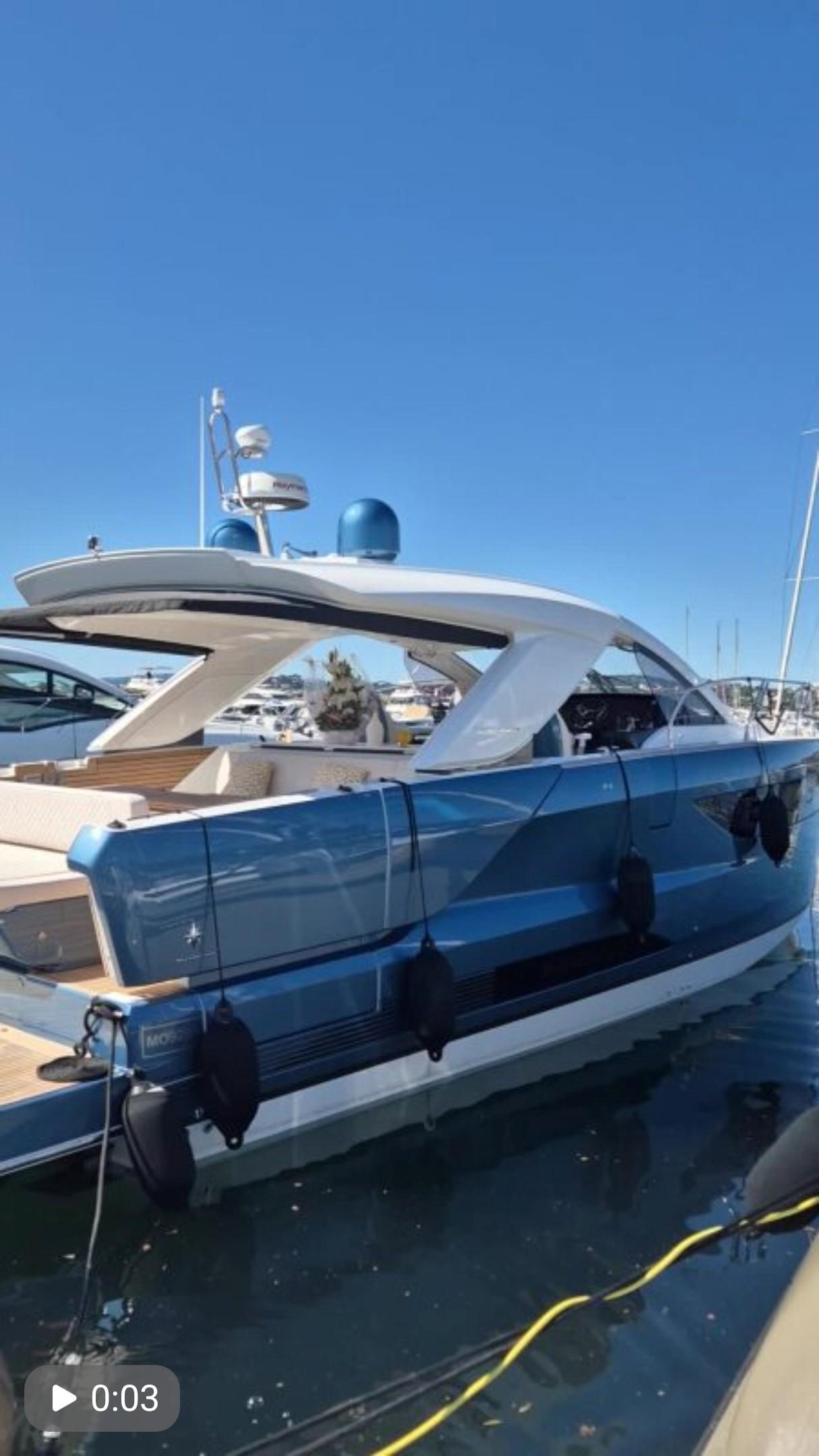 Jeanneau DB/43 IB 2024 Jeanneau DB/43 IB luxury yacht docked in marina under clear blue sky.