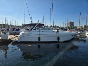 Sea Ray 380 Sundancer 2003 Sea Ray 380 Sundancer yacht docked in a marina under clear blue skies.
