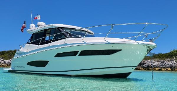 Regal 38 XO 2020 Regal 38 XO yacht anchored in clear turquoise water under a bright blue sky.