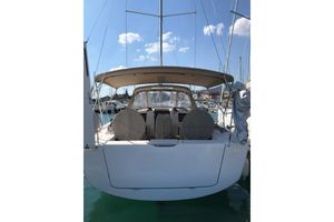 Dufour 390 2020 Dufour Yachts 390 Grand Large sailboat docked in marina, rear view.