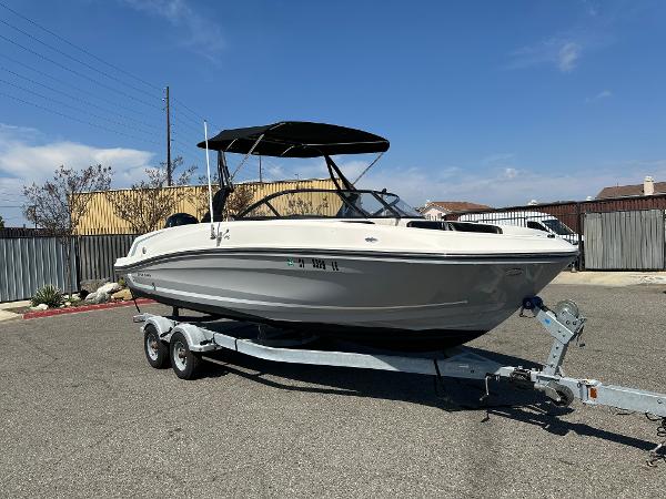 Bayliner VR6 Bowrider OB 2020 Bayliner VR6 Bowrider OB on trailer in parking lot.