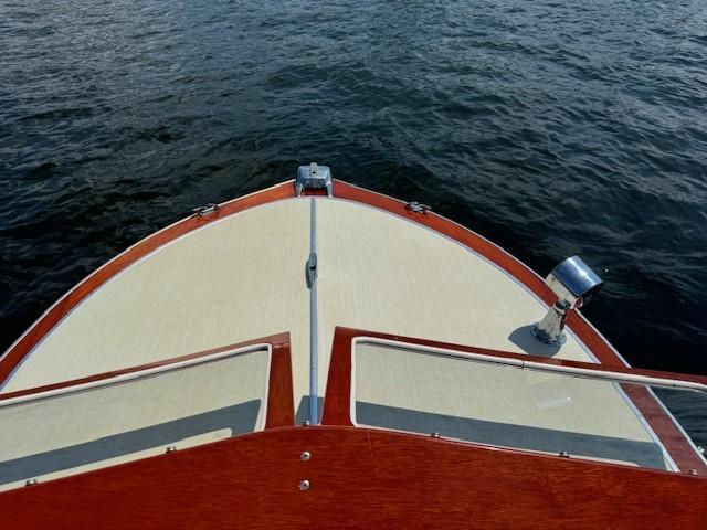 Cruisers runabout 1960 Cruisers runabout boat bow on water, showcasing classic design and craftsmanship.