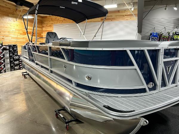 Trifecta 23SBESS 2024 Trifecta 23SBESS pontoon boat in showroom, side view.