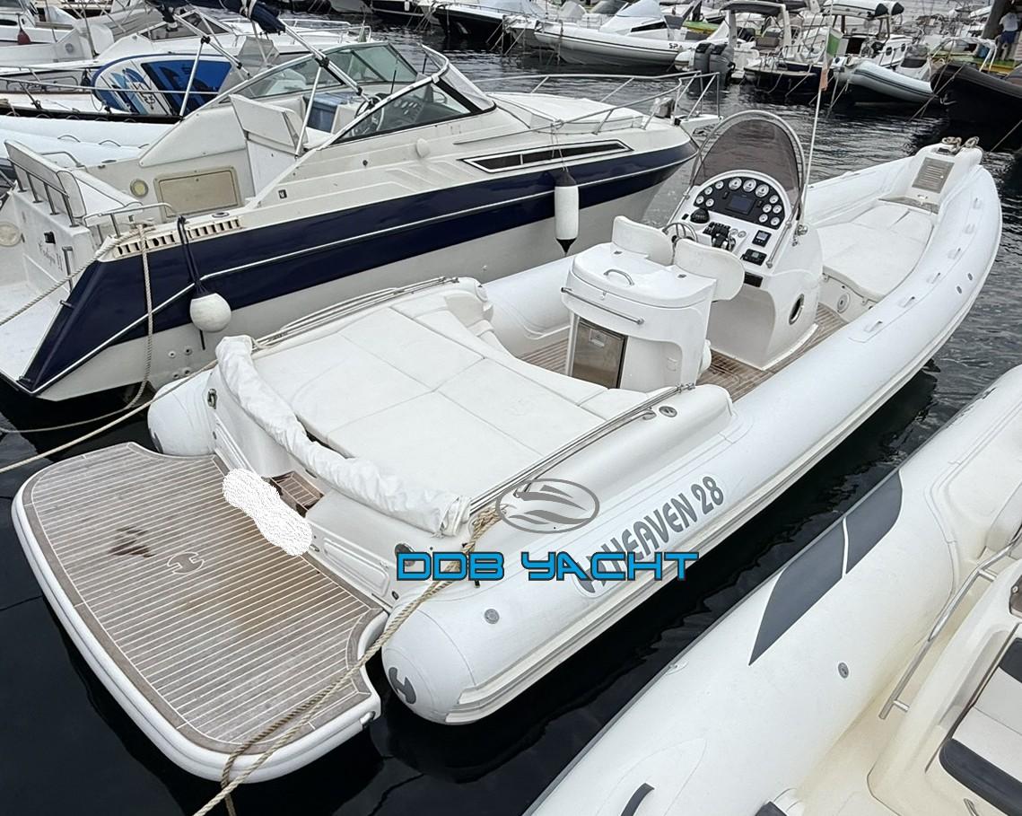 Heaven 28 White Heaven 28 yacht docked at marina, featuring sleek design and modern controls.