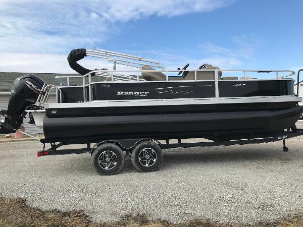 Ranger Reata 200F 2025 Ranger Reata 200F pontoon boat on trailer, side view, outdoors.