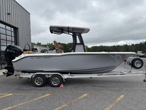 Key West 239 FSR 2025 Key West 239FSR boat on trailer, parked outside a building.
