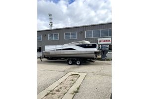 G3 SunCatcher V22 2019 G3 SunCatcher V22 pontoon boat on trailer outside Yamaha dealership.