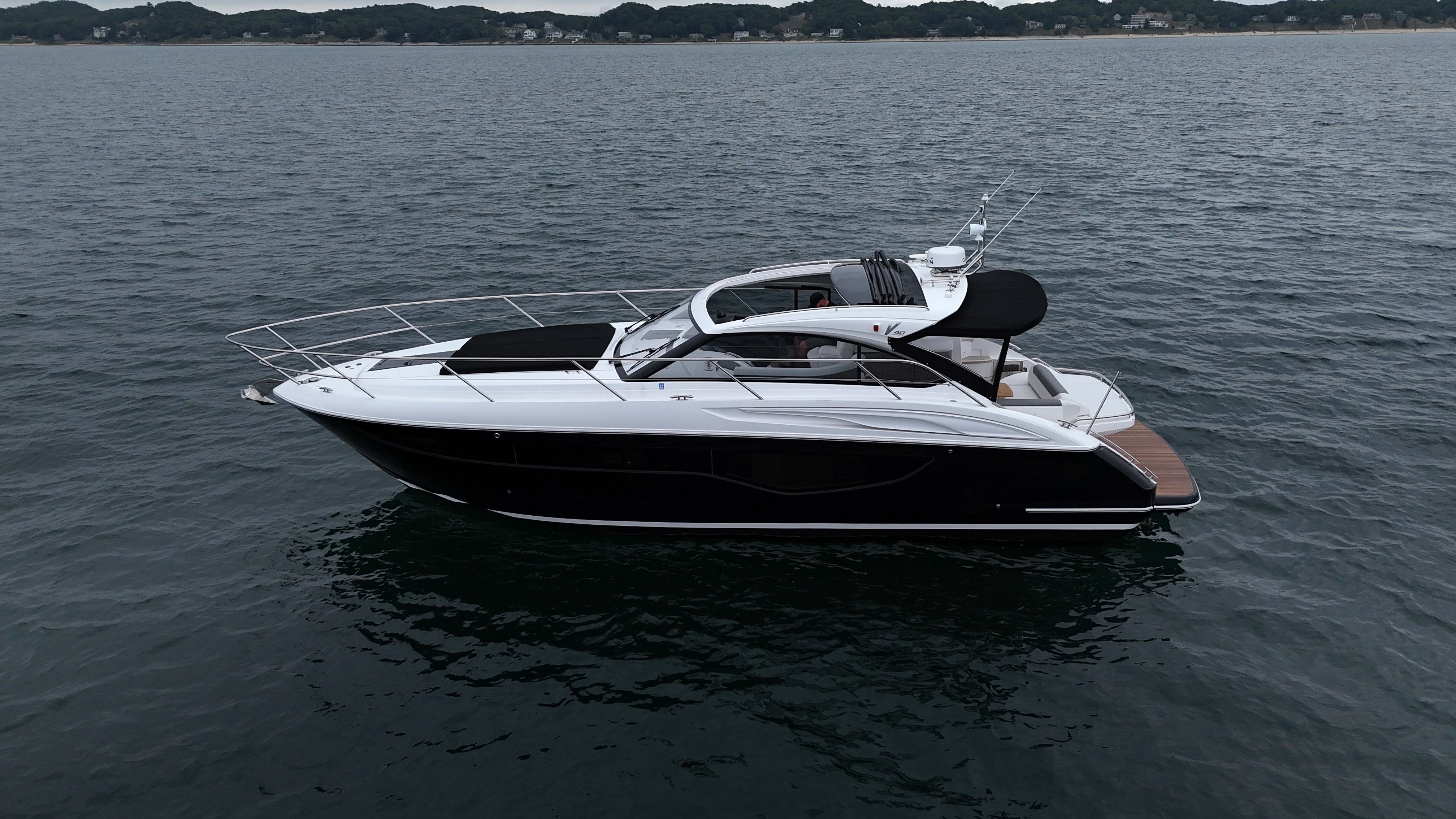 Princess V40 2022 Princess V40 yacht cruising on calm waters, side view.