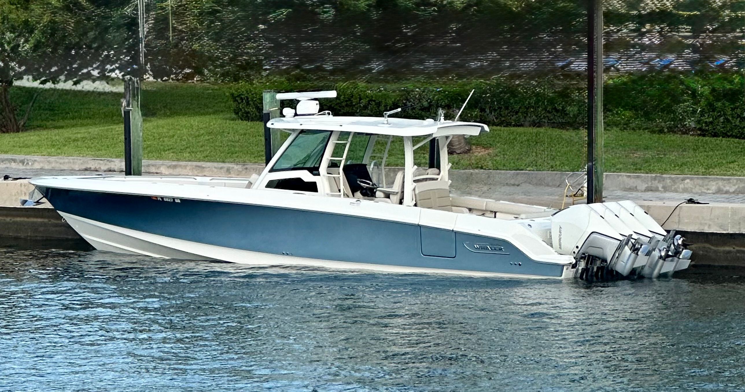 Boston Whaler 380 Outrage 2021 Boston Whaler 380 Outrage boat docked on calm water.