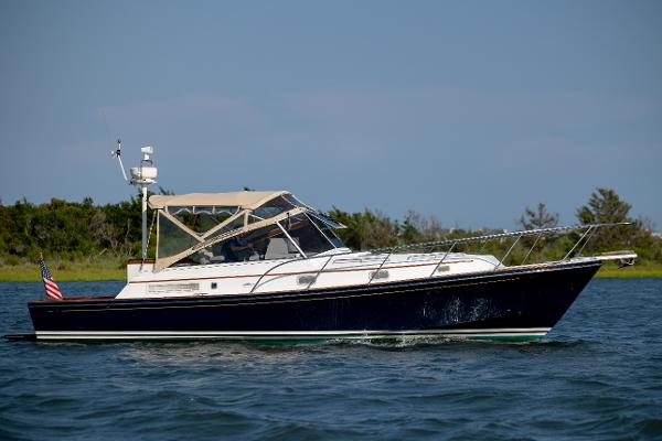 Little Harbor WhisperJet 36 1998 Little Harbor WhisperJet 36 cruising on water with a scenic background.