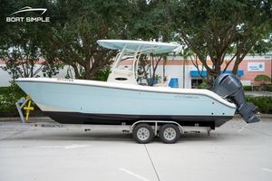 Cobia 240 Center Console 2023 Cobia 240 Center Console boat on trailer, parked outdoors.