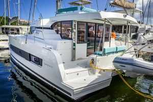 Bali CATSPACE 2024 Bali CATSPACE catamaran docked at marina, featuring modern design and spacious deck.