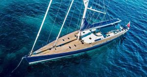 Sailboat JMV 100 Aerial view of 2004 JMV 100 sailboat on clear blue water.