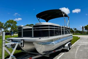 Bennington S22 2022 Bennington S22 pontoon boat on trailer under clear blue sky.