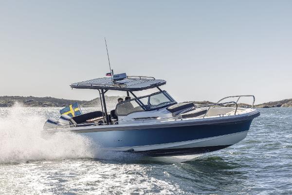 Nimbus T9 X-Edition 2023 Nimbus T9 X-Edition boat cruising on open water, showcasing sleek design and performance.